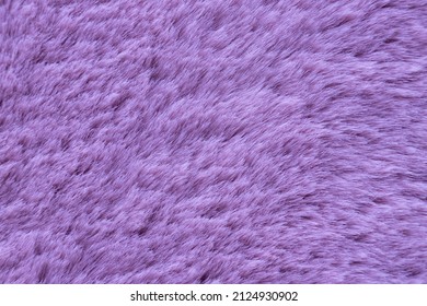 Macro Wallpaper-lavender Long Fiber Soft Fur Close-up. Shaggy Purple Fur For Background Or Texture. Pink Plaid Macro. Pantone Color 2022 Very Peri. Fluffy Fake Textile Fur. Selective Focus. Copy Space