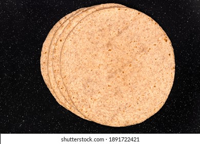 Macro Of Wheat Flour Tortilla Pancakes Isolated On Black, Background And Texture.