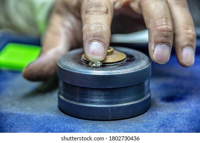 Macro Working Hand Of An Indian Man Holding A Diamond In A Polishing Factory