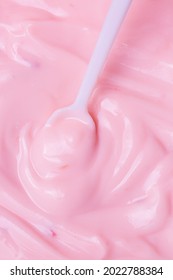 Macro Yogurt,Strawberry Frozen Yogurt Background Close Up. Strawberry Ice Cream Texture Close Up. Top View. Pink Fruit Ice Cream Background With Small Pieces Of Berries