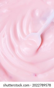 Macro Yogurt,Strawberry Frozen Yogurt Background Close Up. Strawberry Ice Cream Texture Close Up. Top View. Pink Fruit Ice Cream Background With Small Pieces Of Berries