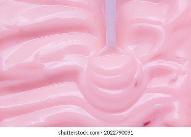 Macro Yogurt,Strawberry Frozen Yogurt Background Close Up. Strawberry Ice Cream Texture Close Up. Top View. Pink Fruit Ice Cream Background With Small Pieces Of Berries