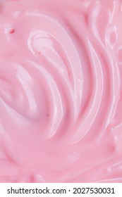 Macro Yogurt,Strawberry Frozen Yogurt Background Close Up. Strawberry Ice Cream Texture Close Up. Top View. Pink Fruit Ice Cream Background With Small Pieces Of Berries