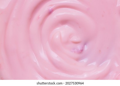 Macro Yogurt,Strawberry Frozen Yogurt Background Close Up. Strawberry Ice Cream Texture Close Up. Top View. Pink Fruit Ice Cream Background With Small Pieces Of Berries