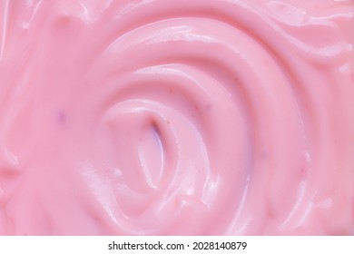 Macro Yogurt,Strawberry Frozen Yogurt Background Close Up. Strawberry Ice Cream Texture Close Up. Top View. Pink Fruit Ice Cream Background With Small Pieces Of Berries