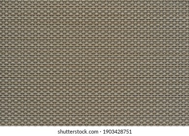 macrotexture of textile material or coarse fabric close-up with symmetric and identical mesh plexus for abstract empty background or for single-tone wallpaper