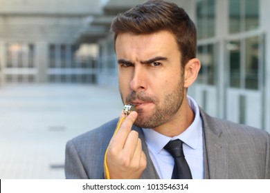 Mad Businessman Blowing A Whistle
