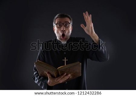 Mad crazy priest surprised expression scared