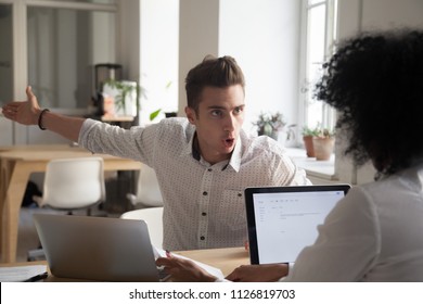 Mad Male Worker Yelling At Female Colleague Asking Her To Leave Office, Multiracial Coworkers Disputing During Business Negotiations, Employees Cannot Reach Agreement, Blaming For Mistake Or Crisis