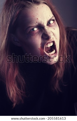 Angry and aggressive young woman