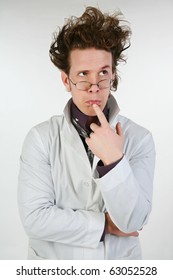 Mad Scientist Or Crazy Doctor In Lab Coat, Glasses, Spiked Hair.