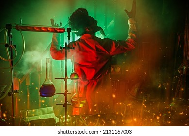 A mad scientist, obsessed with his idea, conducts scientific experiments in his laboratory, illuminated by a mysterious red and green light. Science fiction. Vintage style.
