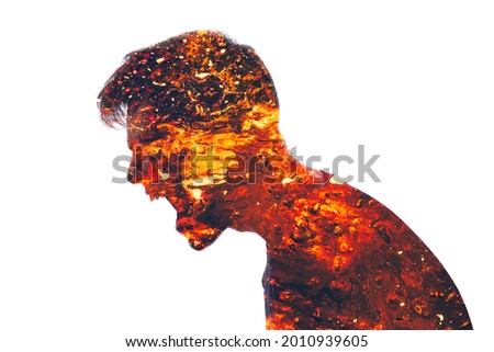 Mad scream. Angry man. Conflict person. Aggression neurosis. Double exposure of furious male silhouette coated in red hot lava isolated on white background.