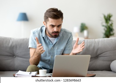 Mad Stressed Young Man Angry About Stuck Laptop Or Pc Failure, Furious Guy Annoyed With Computer Problem Virus, User Confused By Fake Bad Online News, Frustrated With Notebook Breakdown Or Data Loss