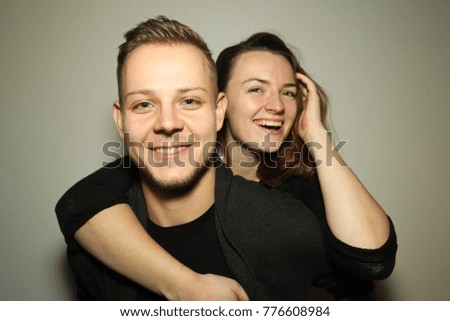 Similar – Young couple posing with funny faces