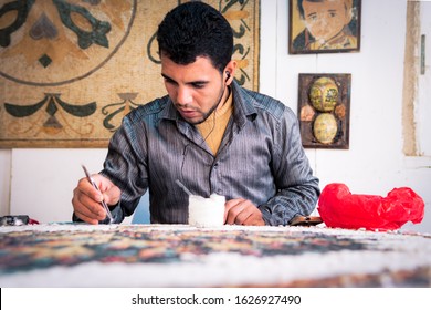 Madaba / Jordan - March 2017: Man while working on a mosaic