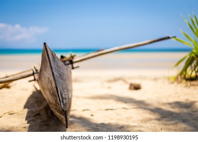 Madagascan Pirogue Boat On The Beach On Nosy Be, Madagascar. Blurred Background.