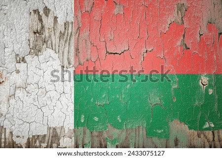 Madagascar flag and paint cracks. Prison concept with border image. Madagascar is currently heading toward recession. Inflation. employment. economic recession. Double exposure hologram