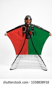 Madagascar Flag Travel. Bird Men In Wing Suit Flag. Sky Diving Men In Parashute. Patriotism, Men And Flag.
                               