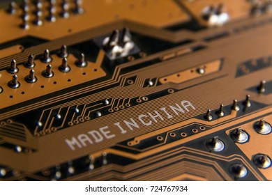 Made in China. Macro of a white inscription on an electrical board.