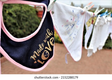 Made With Love Baby Dribble Bib On A Washing Line, Blues And Gold Shades