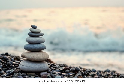 made of stone tower on the beach and blur background
