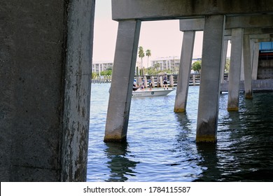 Madeira Beach, FL / USA - July 26 2020: Members Of The Florida Fish And Wildlife Conservation Commission Look For An Injured Dolphin Under The Madeira Beach Causeway.