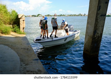 Madeira Beach, FL / USA - July 26 2020: Members Of The Florida Fish And Wildlife Conservation Commission Look For An Injured Dolphin Under The Madeira Beach Causeway.