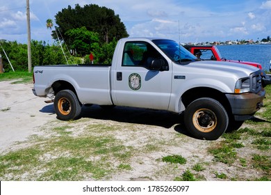 Madeira Beach, FL / USA - July 26 2020: Members Of The Florida Fish And Wildlife Conservation Commission Look For An Injured Dolphin Under The Madeira Beach Causeway.