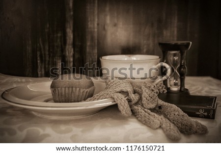 A madeleine cookie with retro cup and gloves on a table Stock photo © 
