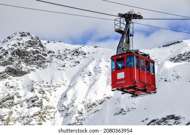 Madesimo cableway, ski resort in the Alps, colorful, snow and mountains