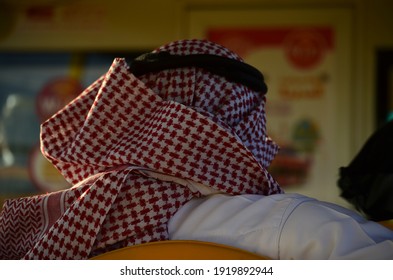 Madinah, Saudi Arabia April 15, 2019 - Photo Of An Arab Man Wearing A Red Turban, Photo Taken From Behind