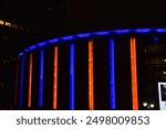 Madison Square Garden lit up in orange and blue 