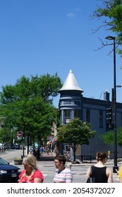 Madison, Wisconsin, United States Of America - June 19, 2021: People Walking Around The Street With A Blue Building In The Background And Copy Space