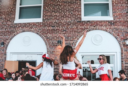 Madison, Wisconsin / United States - September 20, 2017: College Students Enjoy Their Game Day Party While Having A Good Time On The Lake. They Wear Their School Color Red While Dancing And Singing. 