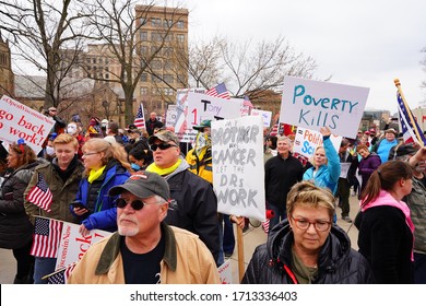 Madison, Wisconsin / USA - April 27th, 2020: Wisconsinites rallied at the Capitol of Wisconsin protest against safer at home order due to the Coronavirus pandemic to allow the state reopen. 