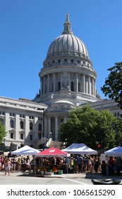 MADISON, WISCONSIN, USA - JULY 29, 2017. People Enjoying Visiting Dane County Madison FarmersÃ? Market On The Square, The Most Popular Market In The State.