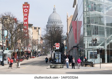 Madison, Wisconsin / USA - June 20, 2019: People Enjoying Shopping And Restaurants On State Street In Madison  Overlooking The Capitol Building And Dome On A Spring Day