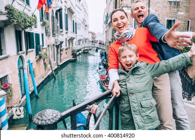 Madly Happy Family Take A Selfie Photo On The One Of Bridge In Venice