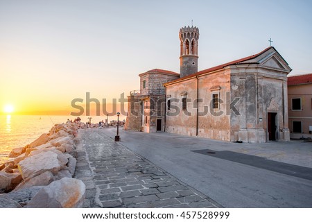 Madona cape with saint Clement church in Piran town at the sunset in Slovenia