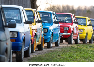 Madona, Latvia - May 01, 2021:  row of colorful stylish vintage Fiat 126 PanCars rental cars, PanCars is a stylish compact car rental for team building , fun races and individual events