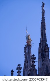 Madonnina statue on the famous Milan Cathedral (Duomo di Milano) on piazza in Milan, Ital