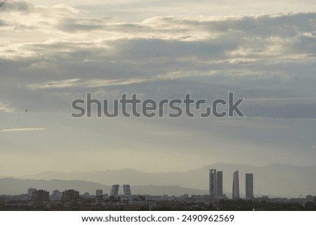 Madrid city skyline with towers silhouette and cloud sky