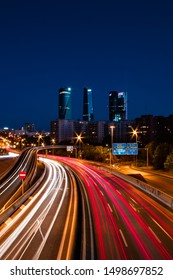 Madrid Cuatro Torres Skyscrapers At Night, Long Exposure Light Trails