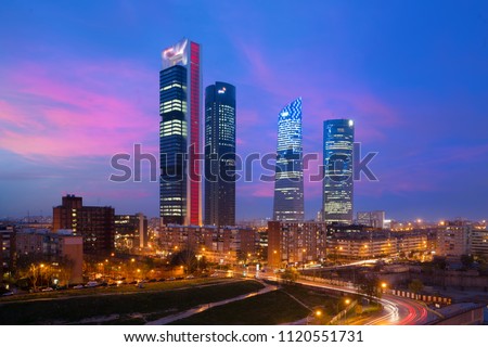 Madrid Four Towers financial district skyline at twilight in Madrid, Spain. Europe tourism, modern city life, or business finance and economy concept