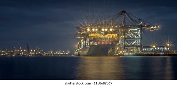 The Madrid Maersk. The Worlds Second Largest Container Ship Of The Maersk Shipping Line, Unloading At Night In Felixstowe Docks, The UK's Largest Container Port. On 20th August 2017.