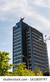 MADRID - MAY 5, 2019: Low-angle View Of The Headquarters Of The Spanish Insurance Company Mutua Madrileña At The Paseo De La Castellana In Madrid, With The Blue Logo Of The Company To Be Recognised.