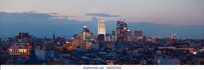 Madrid Rooftop View Of The City Skyline With Business District Skyscrapers At Night In Spain.