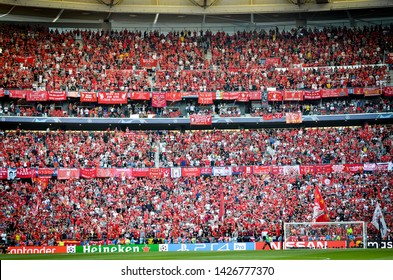 Madrid, Spain - 01 MAY 2019: Liverpool fans in the stands support the team during the UEFA Champions League 2019 final match between FC Liverpool  vs Tottenham Hotspur at Wanda Metropolitano, Spain