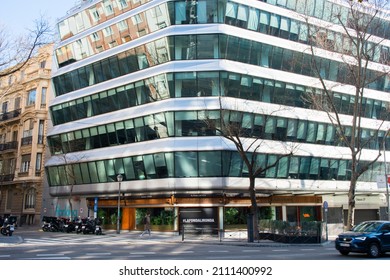 Madrid, Spain; 01212022: Renovated Building In Genova Street. Restaurant La Fonda Lironda. Incidental Person Crossing The Street. Sunny Day, Empty Street.